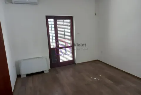 Empty room with wooden flooring, air conditioning unit, and a door leading to the terrace. - image 5
