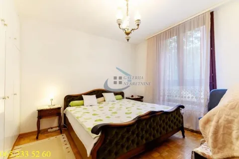 Bedroom with a double bed, bedside tables, and a wardrobe. - image 17
