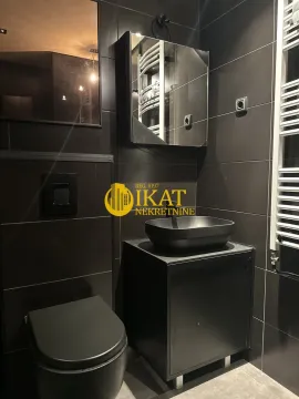 Modern bathroom in black tones with a basin and built-in sanitaryware. - image 11