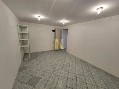 Empty room with ceramic floor tiles and a shelf against the wall. - image 4