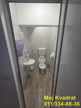 Small bathroom with a toilet and washbasin. - image 17