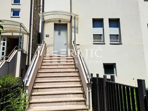 Entrance to a residential building with exterior stairs and a canopy. - image 17
