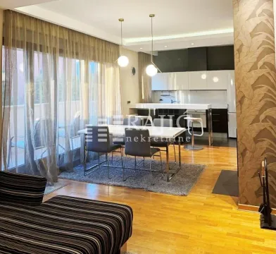 Living room with dining area and kitchen in the background. - image 4