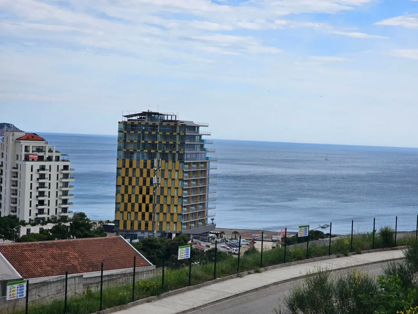 View of the sea and surrounding buildings from the terrace.