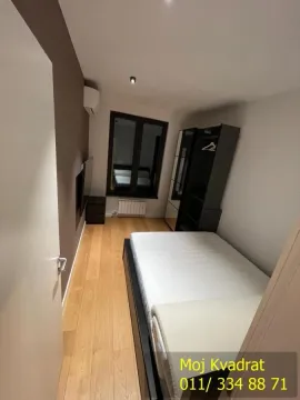 Smaller bedroom with a bed and a wardrobe. - image 12
