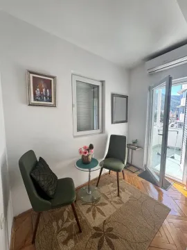 Living room with seating furniture and access to the terrace. - image 4