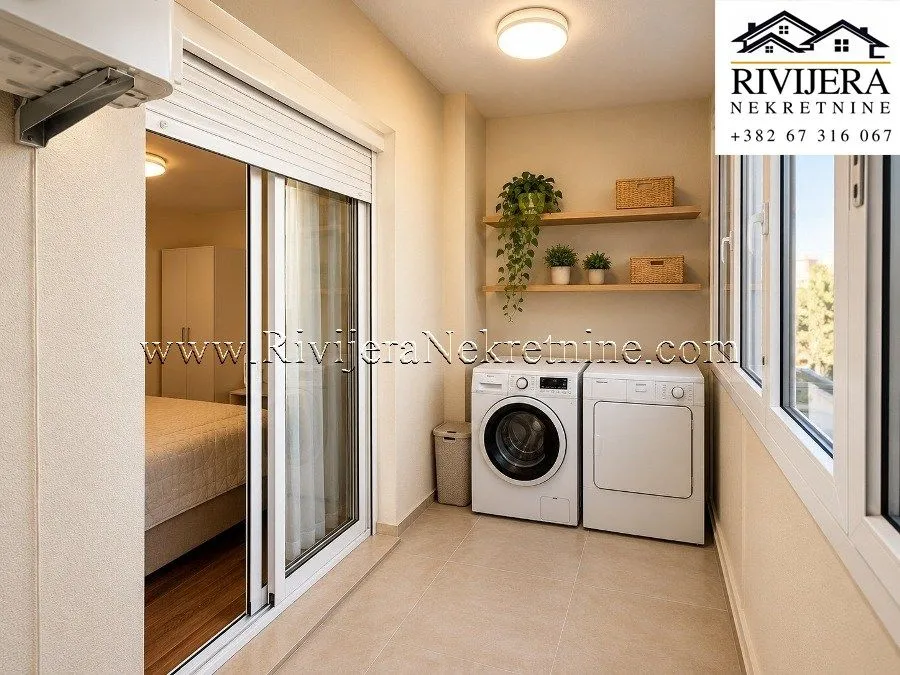 Enclosed terrace with a washing machine and tumble dryer.