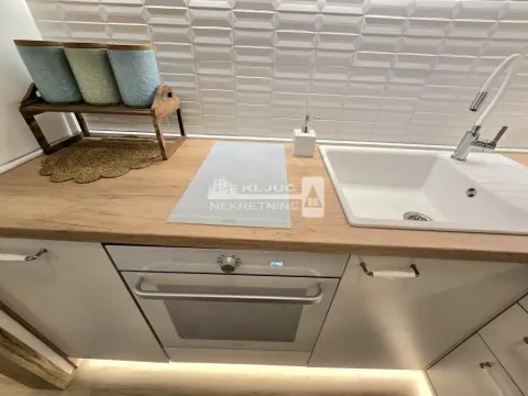 Part of the kitchen with built-in oven, sink and countertop. - image 6