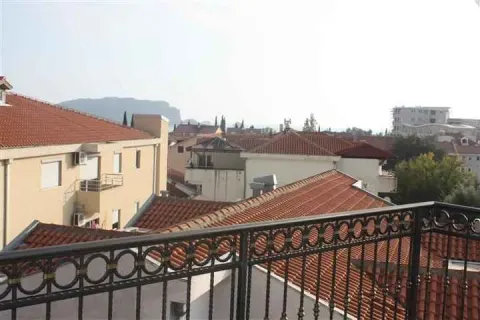 View from the terrace towards the surrounding rooftops and neighborhood. - image 9