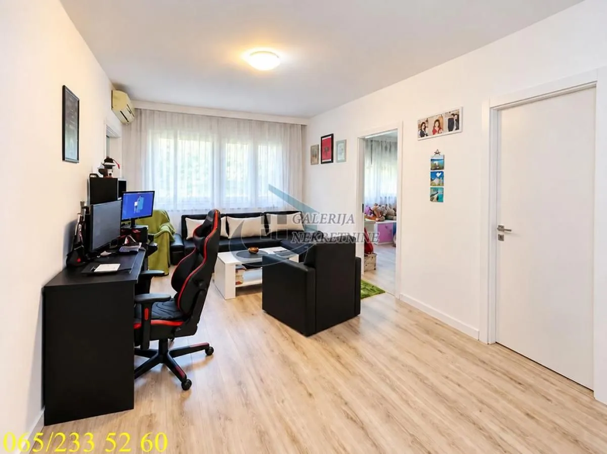 Living room with a desk and seating set.