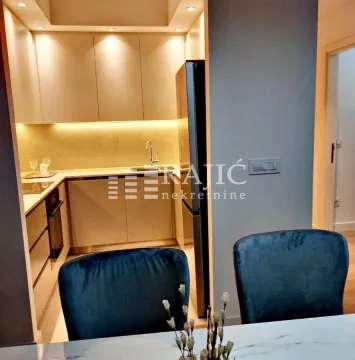 View of the modern kitchen from the dining area. - image 17