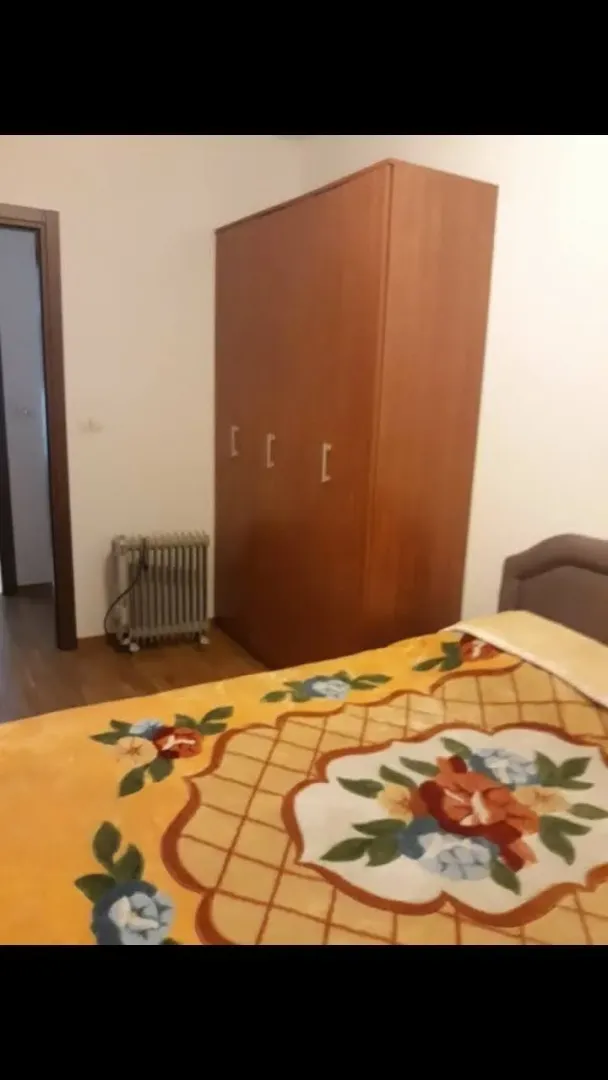 Bedroom with a wardrobe and a bed.