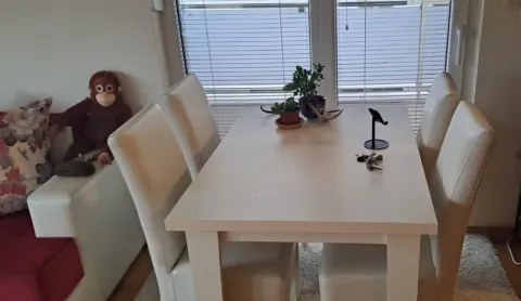 Dining table with chairs in the living room. - image 3