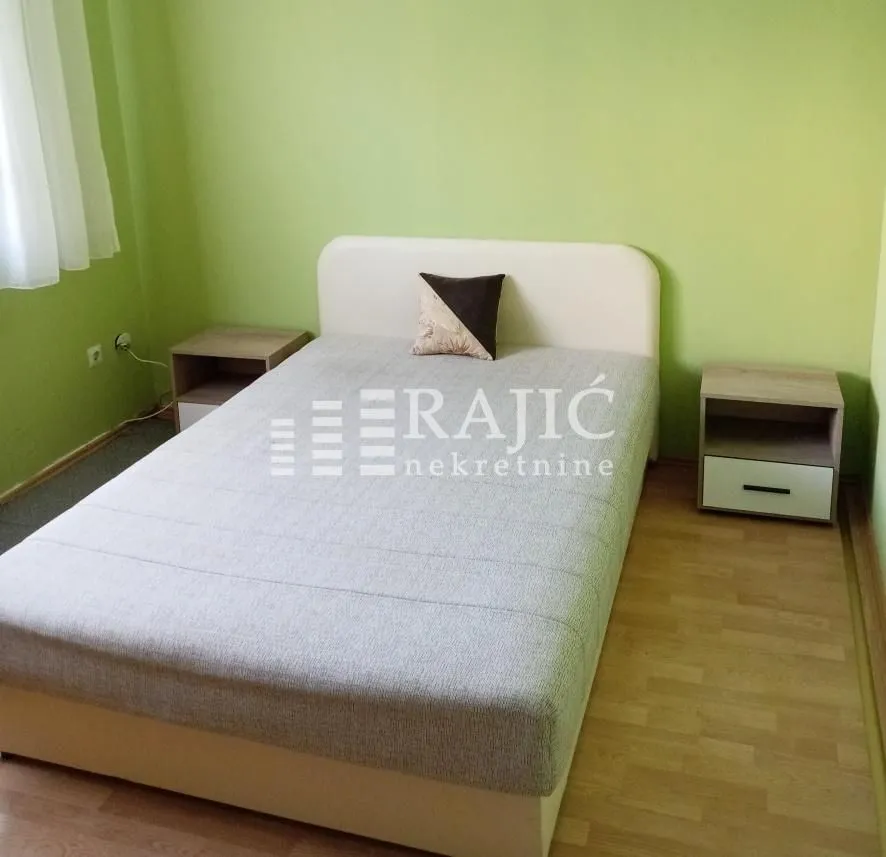 Bedroom with a double bed and nightstands.