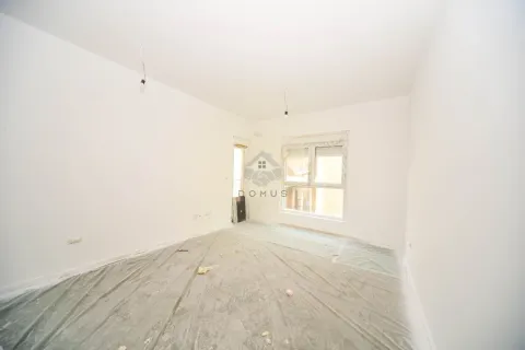 An empty room with white walls prepared for renovation. - image 2