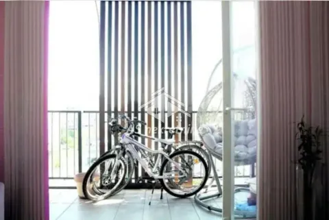 Covered balcony with bicycles and a hanging chair. - image 11