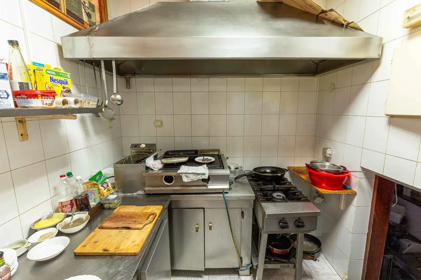 Kitchen with professional catering equipment.