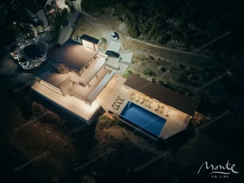 Night aerial view showing a modern villa with an illuminated swimming pool and terrace. - image 37