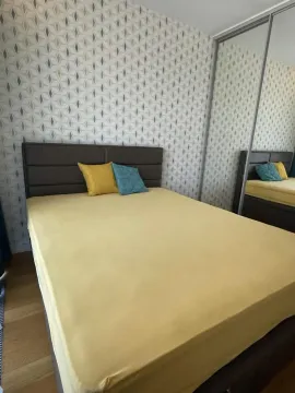 Bedroom with a double bed and a fitted wardrobe with mirrors. - image 6