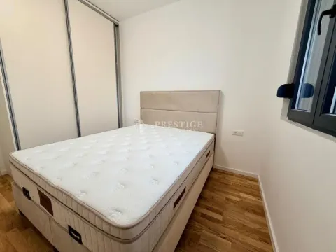 Furnished bedroom with a double bed and built-in wardrobe. - image 9
