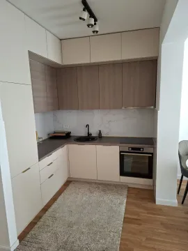 Bright modern kitchen with built-in appliances. - image 7