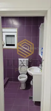 Smaller bathroom with purple tiles and sanitary ware. - image 6