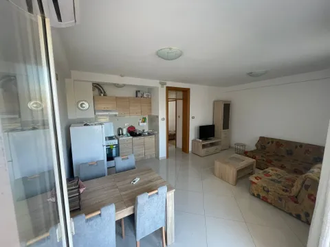 Spacious living room connected to the dining area and kitchen. - image 2