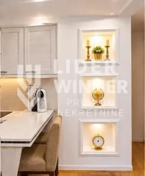Small kitchen with a breakfast bar and decorative recessed wall niches. - image 7