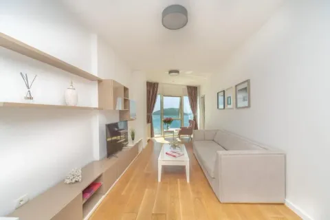 Bright living room with sofa, TV and sea view. - image 3