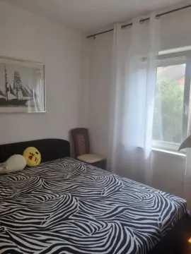 Bedroom with a double bed and a window. - image 10