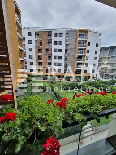 View from the terrace overlooking an apartment building and courtyard.