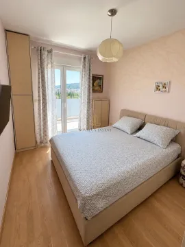 Furnished bedroom with a double bed, wardrobe, and access to the terrace. - image 8