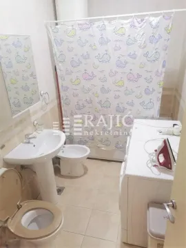 Smaller bathroom with a sink, toilet, bidet, and shower cabin. - image 15