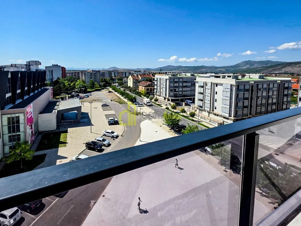 View from the terrace overlooking city streets and surrounding buildings.