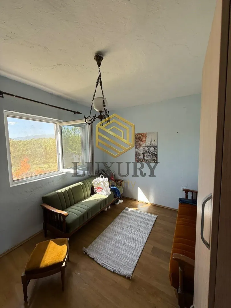 Small living room with furniture and a window.