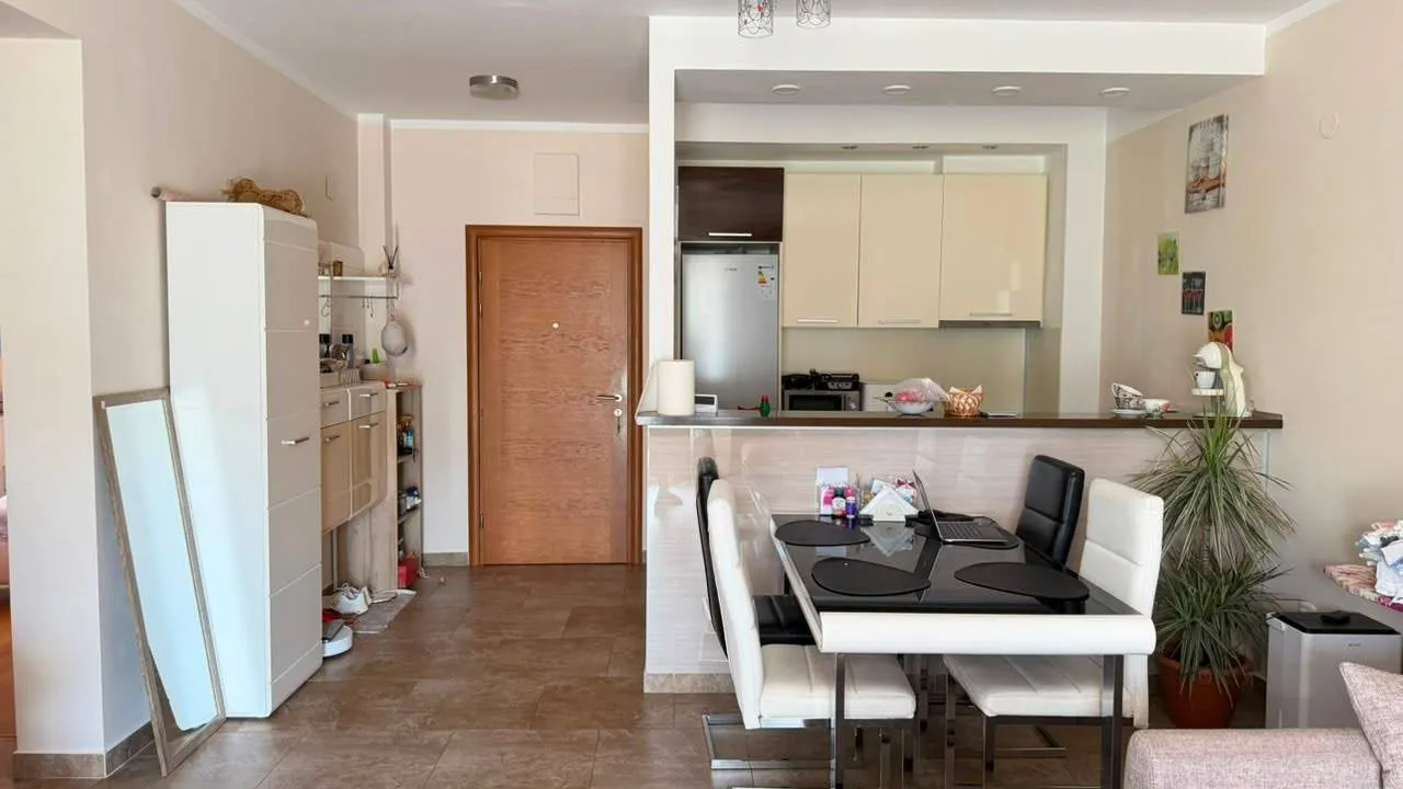 Living room with dining area and kitchen.