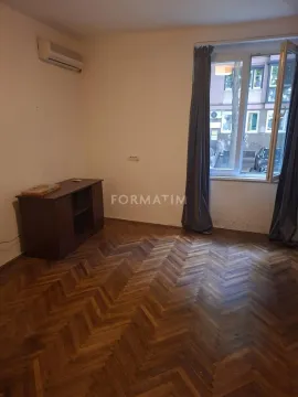 Empty room with wooden parquet flooring and a window. - image 3