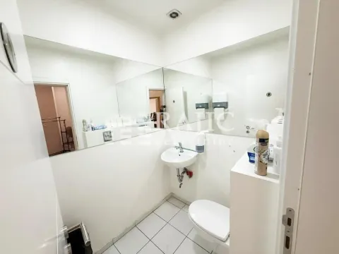 Small bathroom with a sink and toilet. - image 14