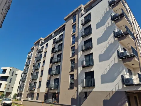 Exterior view of a modern residential building with balconies and railings. - image 8