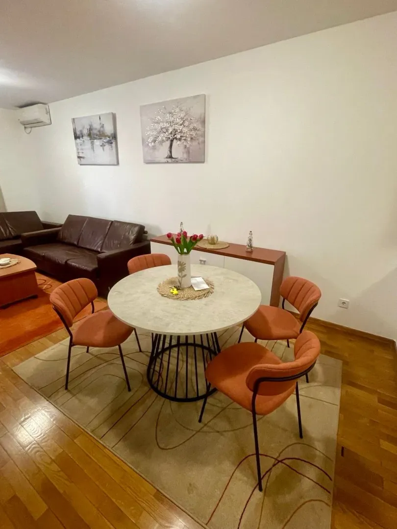Living room with a dining table and chairs.
