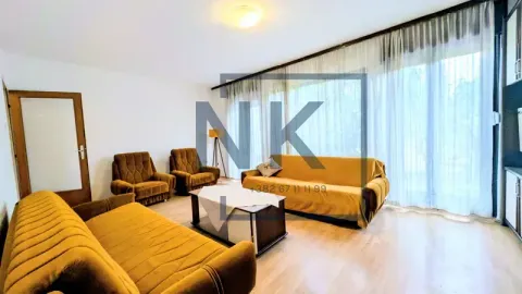 Living room with seating furniture and a large window. - image 2