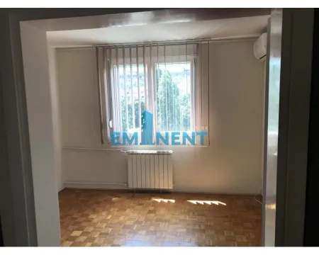 Empty room with parquet flooring and a window with blinds. - image 3