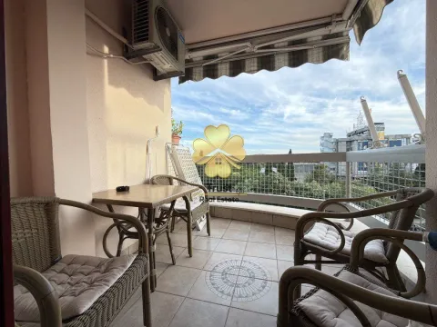 Furnished balcony with seating set and a view of the surroundings. - image 9