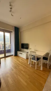 Living room with dining area and access to the terrace. - image 2