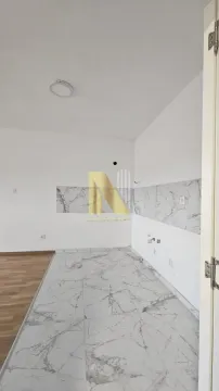 Unfurnished kitchen area with ceramic tiles on the wall and floor. - image 15
