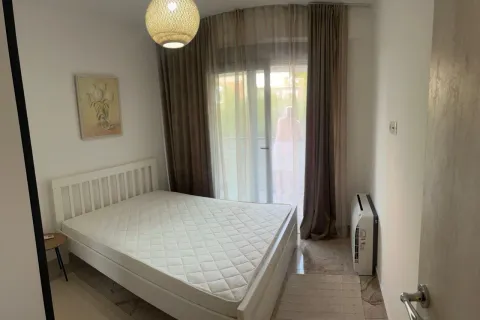 Bright bedroom with a double bed and balcony access. - image 8