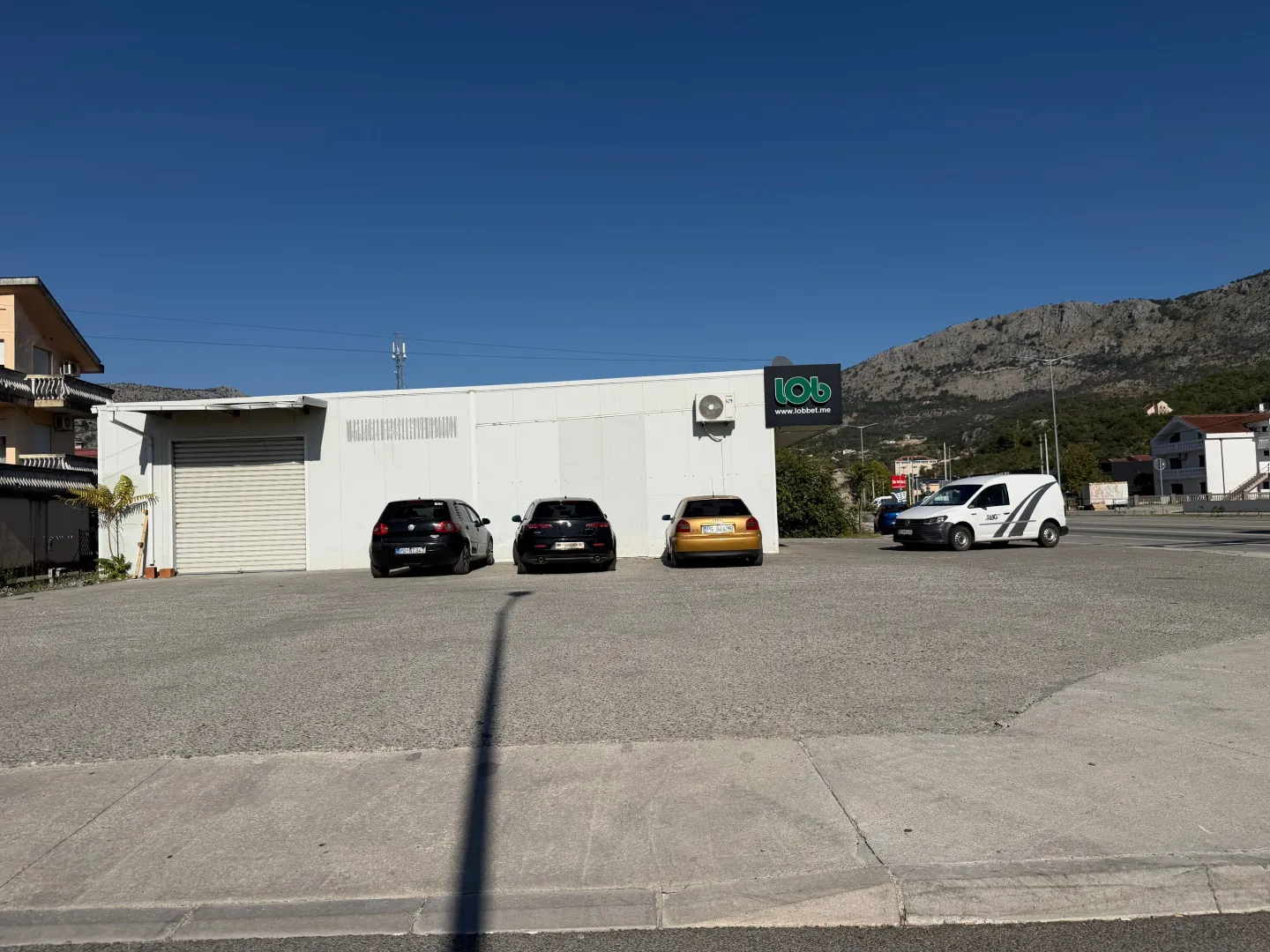 Exterior of a commercial building with parking in front.