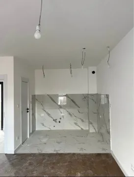 Unfinished kitchen space with marble-patterned ceramic tiles. - image 6