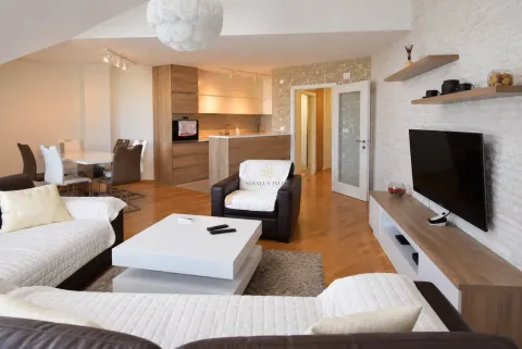 Spacious living room connected to the dining area and kitchen. - image 2