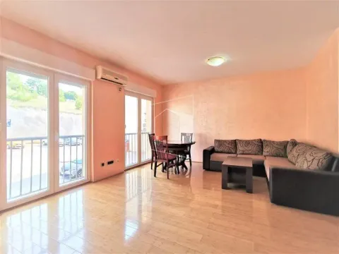 Spacious living room with a sofa set, dining table, and access to the terrace. - image 4